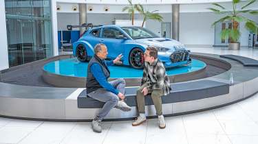 Auto Express consumer reporter Tom Jervis sitting in front of a Hyundai N car